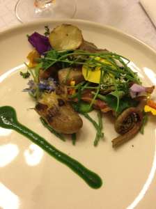 Surf and Turf Salad- Fried Chicken Skins, Sea Beans, Nasturtium, Pansies, petit onions, root greens, Romaine Puree, Spring Green Pea Gazpacho, Morels, Fiddlehead Ferns, Poached Baby Potatoes, Shaved Chorizo - close up